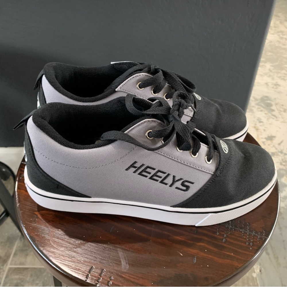 Men’s size 10 Heelys. Brand new never been worn.Gray and Black.